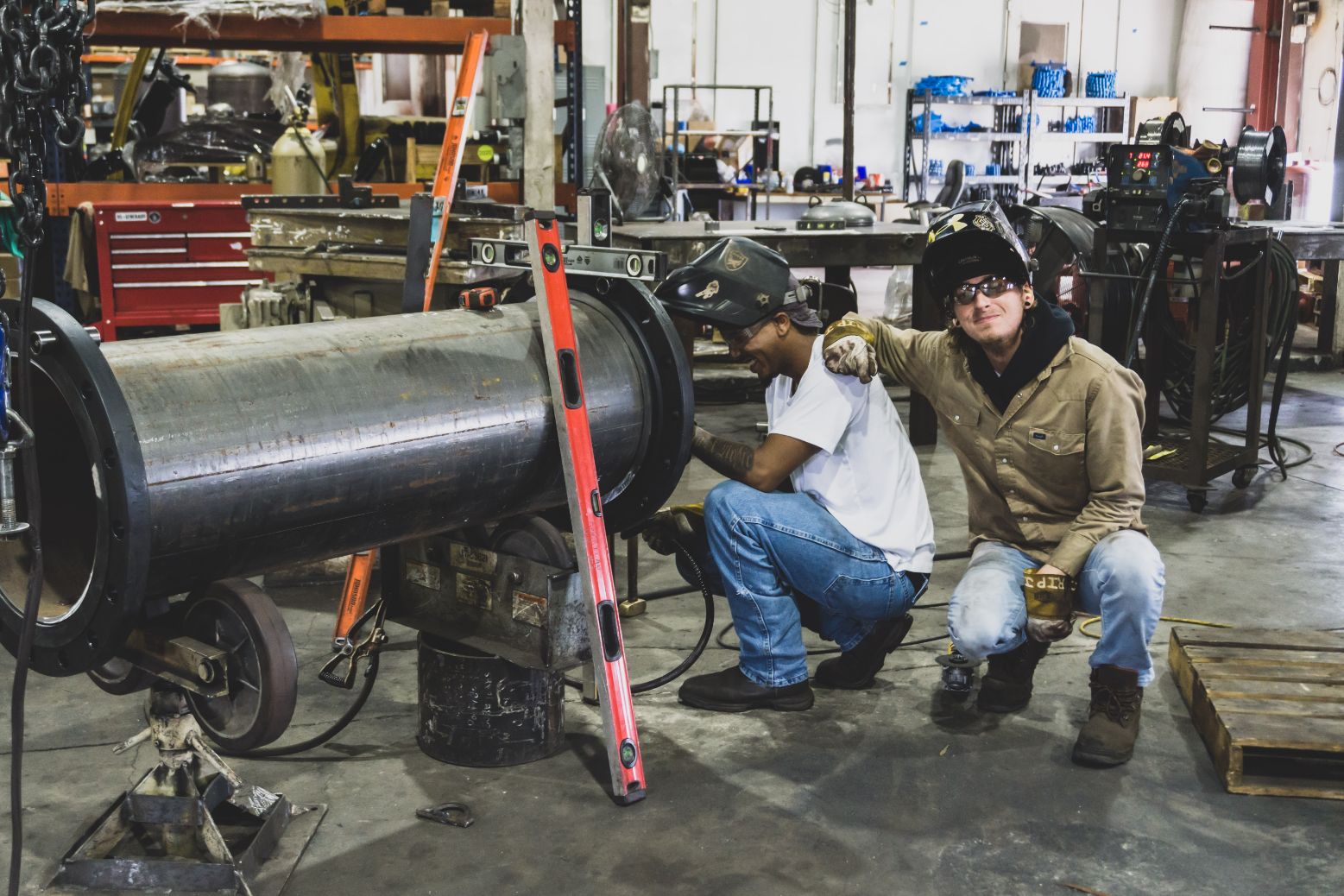 two mechanics working in shop